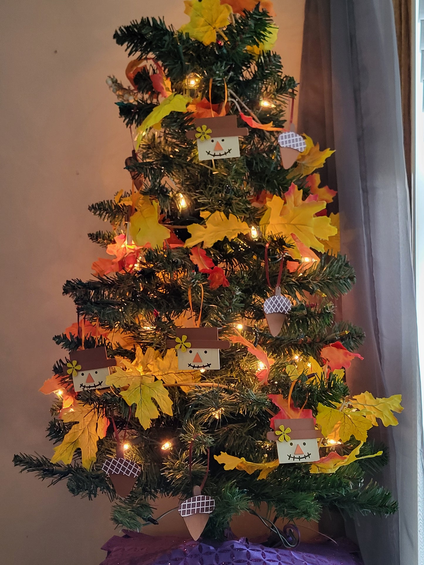 Set of 12 handmade Fall ornaments - 6 scarecrows and 6 acorns - for seasonal decorating.