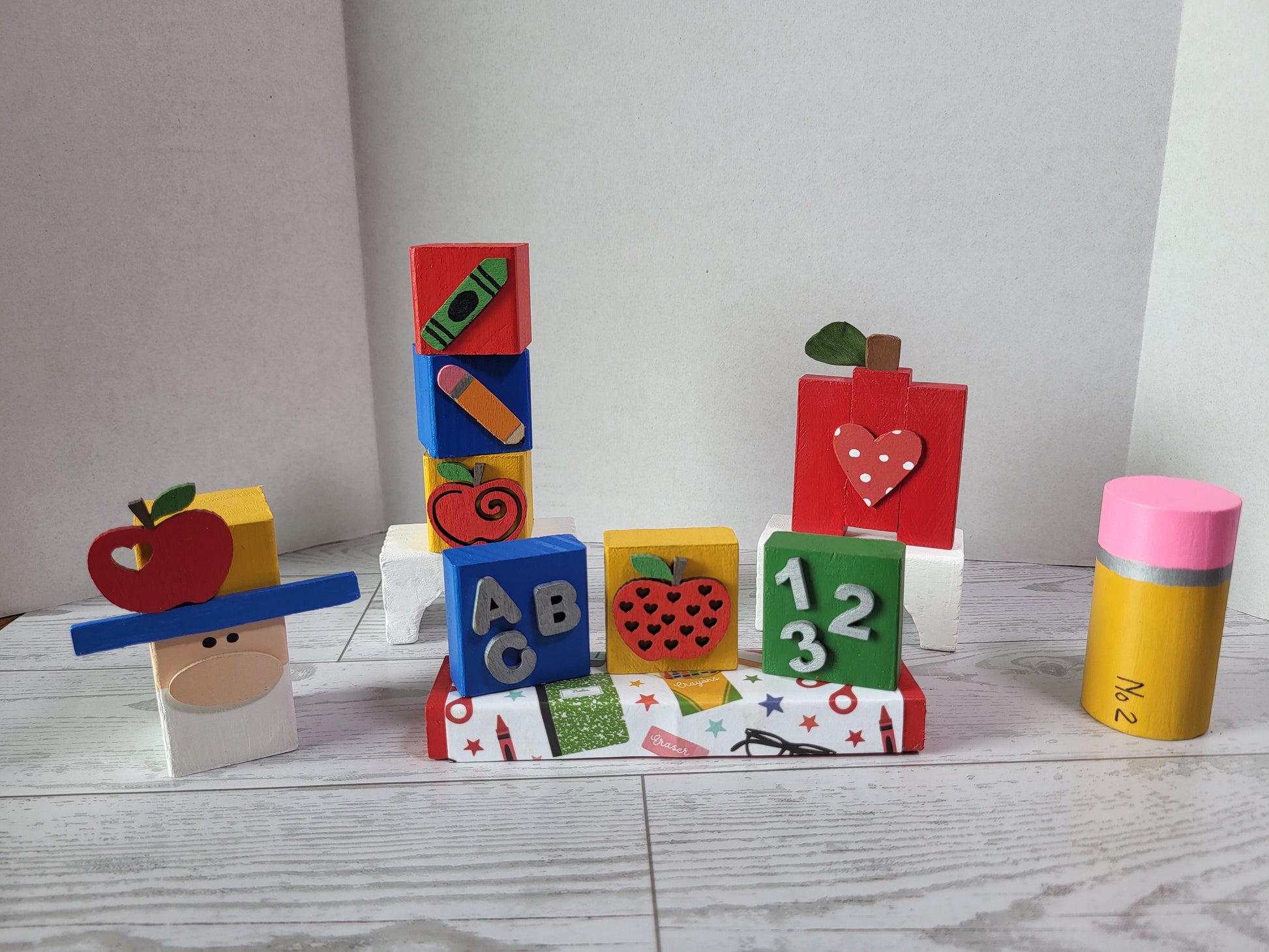 Hand-painted wooden Back to school shelf sitters with festive fun school designs—perfect for mantels, tiered trays, and farmhouse holiday décor.
