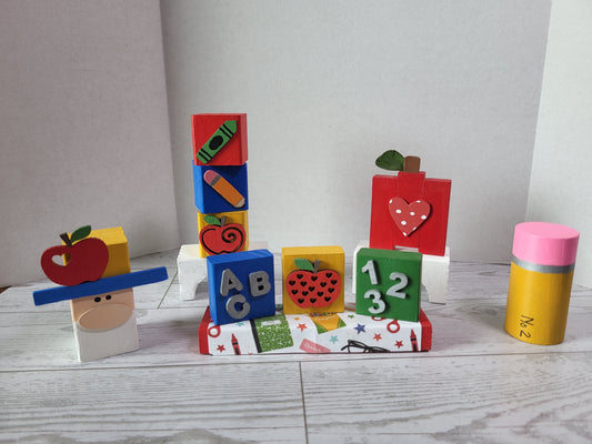Hand-painted wooden Back to school shelf sitters with festive fun school designs—perfect for mantels, tiered trays, and farmhouse holiday décor.