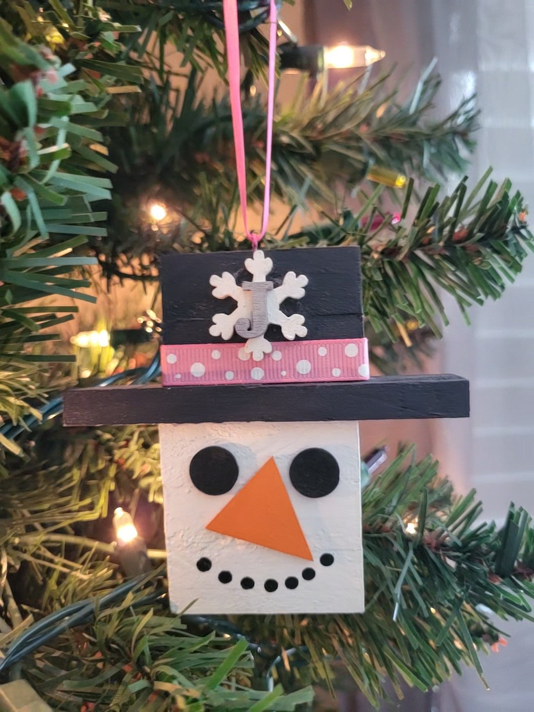 Hand-painted wooden snowman ornament personalized with initial and custom ribbon colors—perfect for Christmas tree décor, gifts, and holiday keepsakes.”
