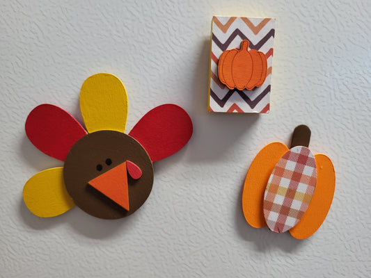 Handmade wooden magnets with holiday or seasonal designs - perfect for fridges, office boards, or any magnetic space.