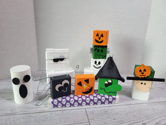 Hand-painted wooden Halloween shelf sitters with festive holiday designs—perfect for mantels, tiered trays, and farmhouse holiday décor.