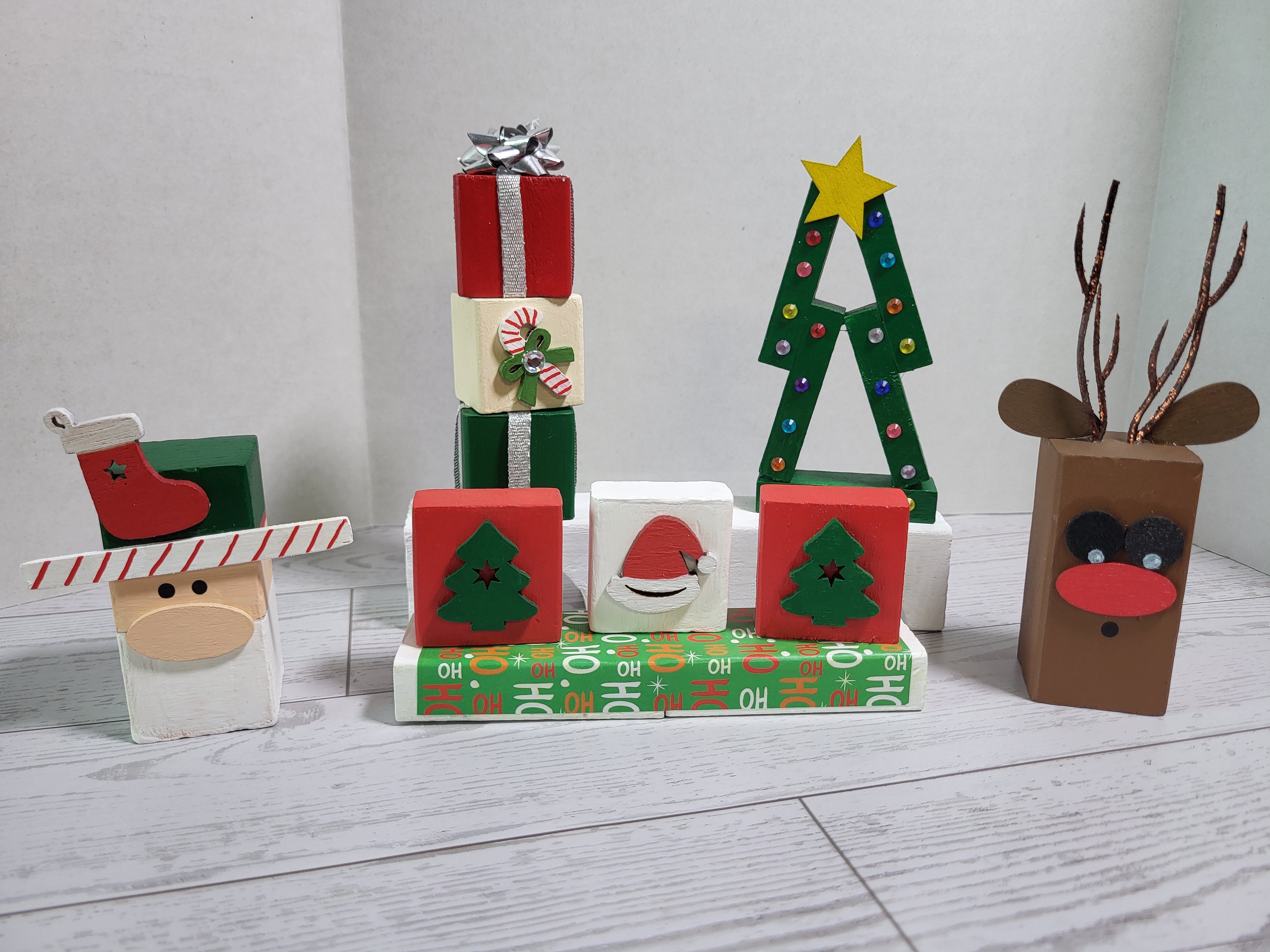 5 piece handmade wooden Christmas shelf sitter collection with hand-painted Christmas designs.