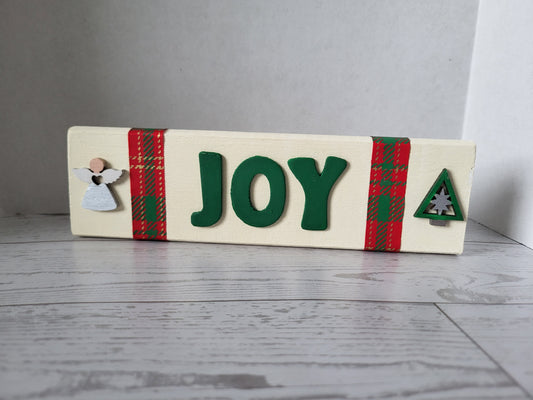 Handmade wooden Christmas word sign with Christmas green letters, plaid ribbon, and an angel and tree accent. 