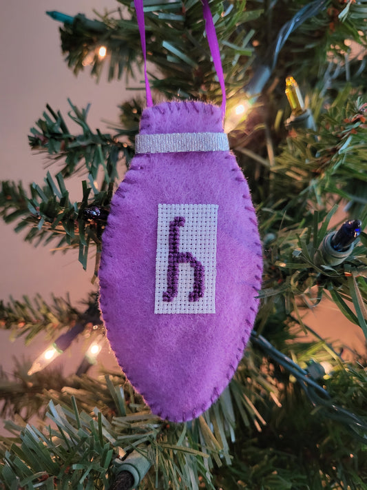 Hand-stitched felt Christmas bulb ornament personalized with initial and custom colors—perfect for Christmas tree décor, gifts, and holiday keepsakes.